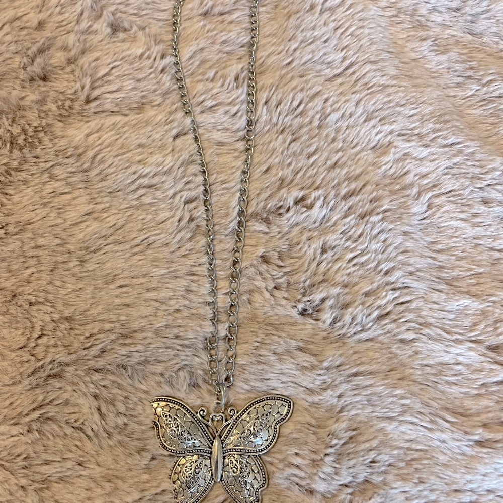 Cute silver butterfly necklace. In excellent shape